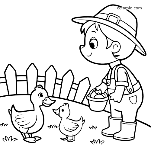 Un enfant de la ferme en chapeau et bottes tient un seau et nourrit deux canards près d’une clôture en bois.